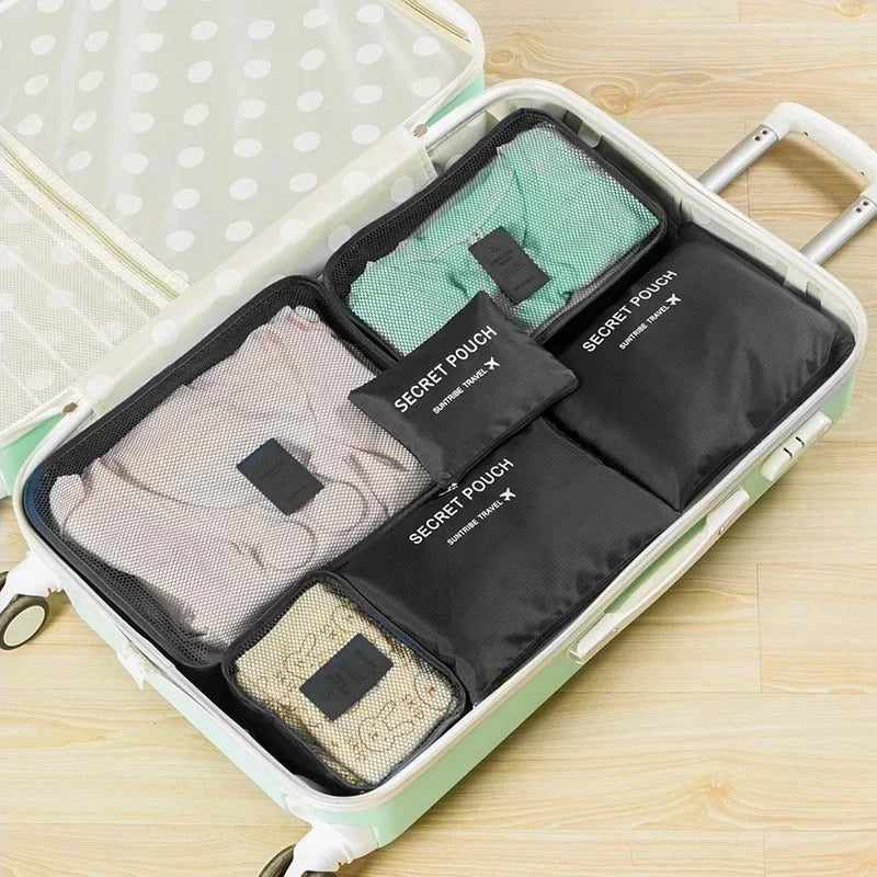 Troveze Foldable Travel Packing Cubes (Set of 6): black six-piece set arranged inside an open suitcase