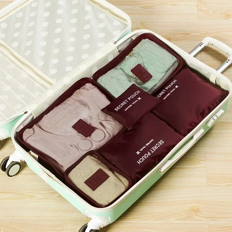 Troveze Foldable Travel Packing Cubes (Set of 6): wine red six-piece set laid out in a suitcase