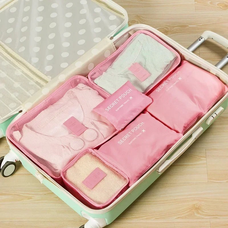 Troveze Foldable Travel Packing Cubes (Set of 6): pink six-piece set packed into an open suitcase