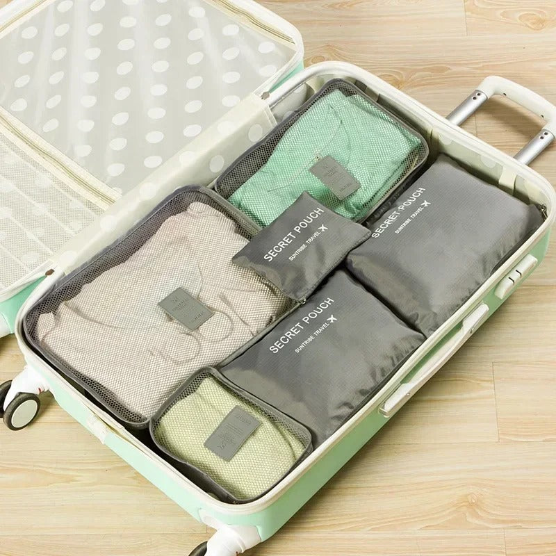 Troveze Foldable Travel Packing Cubes (Set of 6): grey six-piece set organised inside a suitcase